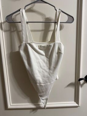 Lulu's White Ribbed One-Piece Bodysuit